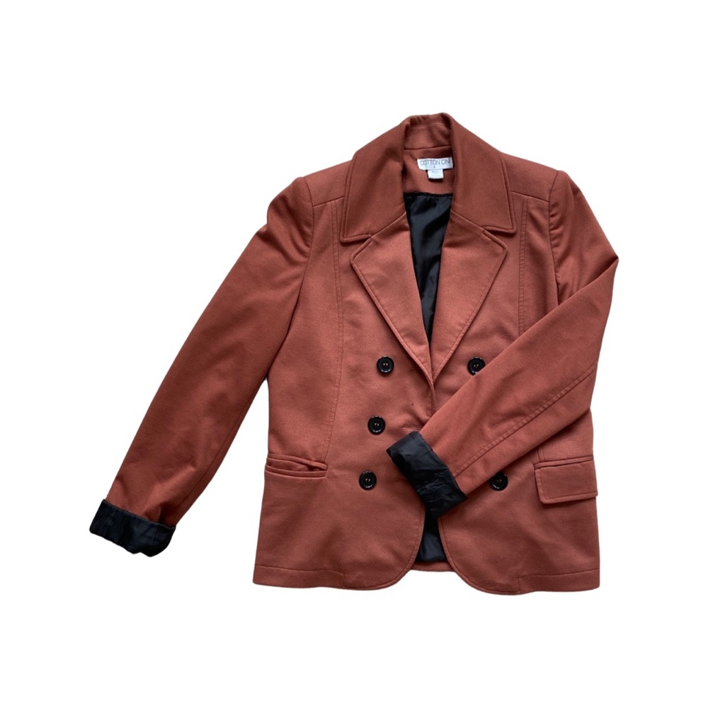 Burnt orange blazer with black buttons